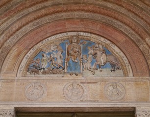 The colourful madonno relief of the cathedral in Verona in Italy