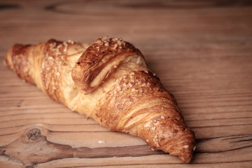 Fresh Croissant on a wooden background