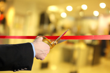 Grand opening, cutting red ribbon