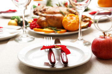 Baked chicken for festive dinner. Christmas table setting