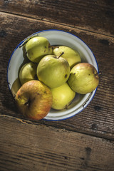 Apples in vintage metal cup