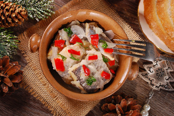 herring salad for christmas on wooden table