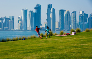 Boys playing football in Doha Qatar