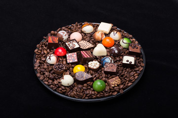 Set of a various chocolate pralines and coffee beans