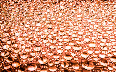 Water drop on glass background.