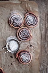 sweet rolls with cinnamon, chocolate and powdered sugar
