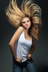 Fototapeta premium Beautiful girl with great fly-away hair