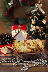 Obraz na płótnie Canvas Piece of Panettone - sweet bread loaf with fruit traditional for