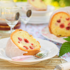 A Slice of Lemon and Caraway Seed Bundt Cake with Raspberries