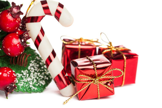 european holly with candy cane and gift box