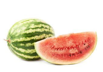 Whole watermelon next to a slice