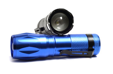 two compact flashlight on a white background