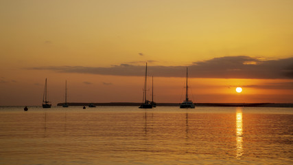 Naklejka na ściany i meble Sailing Boats At Sunset