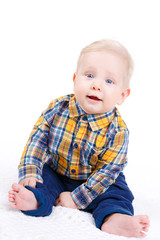 Portrait of a little boy on white background.