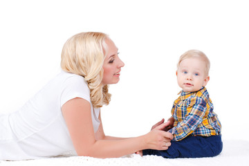 Young mother playing with her little son.