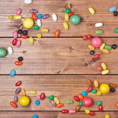 Candies lying over the wooden surface