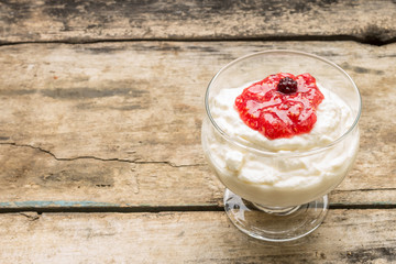 Dairy sweet dessert with strawberry jam and Fresh blueberry