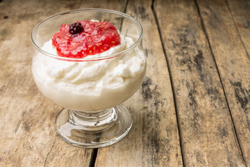 Dairy sweet dessert with raspberry jam and Fresh blueberry