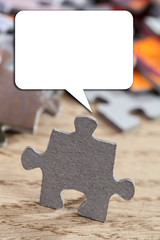 Closeup of Jigsaw Puzzle Piece with Talking Buble