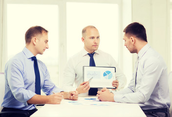 Fototapeta premium serious businessmen with papers in office