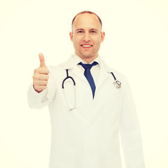 smiling doctor with stethoscope showing thumbs up