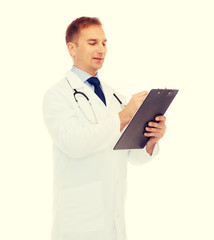 smiling male doctor with clipboard and stethoscope