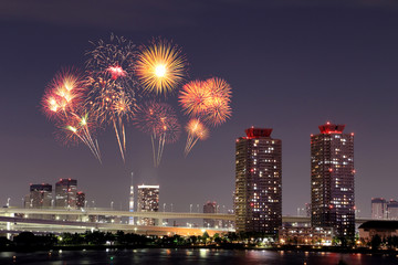 Fireworks celebrating over Odaiba, Tokyo cityscape at night