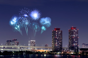 Fireworks celebrating over Odaiba, Tokyo cityscape at night