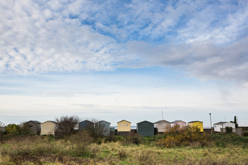 Fototapeta na wymiar Beach huts in a row, Whitstable