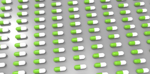 white and green color pills on grey gray background