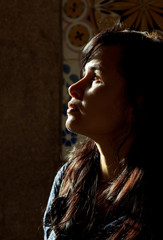 Backlight profile of a young beautiful woman