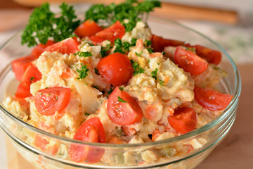 Homemade Potato Salad with Eggs and Pickles In Glass Bowl
