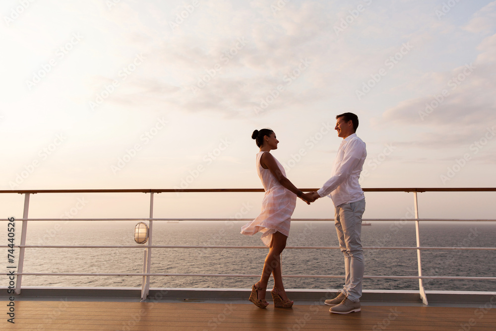 Wall mural lovely couple holding hands on a cruise