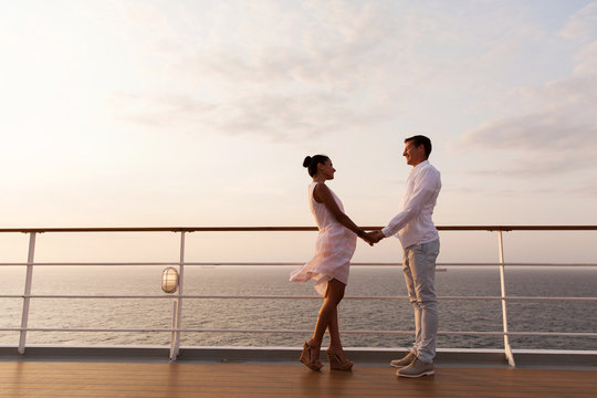 lovely couple holding hands on a cruise
