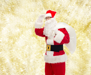 man in costume of santa claus with bag
