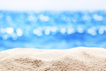 Fototapeta na wymiar Sand with blurred sea background.