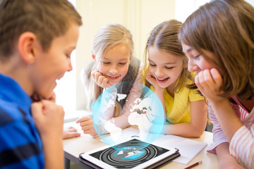 group of school kids with tablet pc in classroom