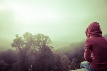 woman hiker enjoy the view at mountain peak