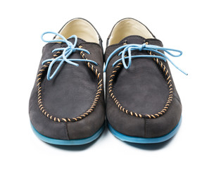 Black men's leather loafers with blue soles and laces on a white