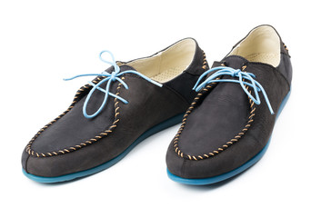 Black men's leather loafers with blue soles and laces on a white