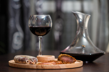 Meat fillet sausage and red wine