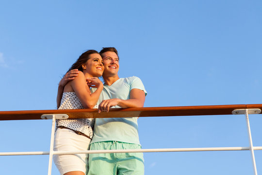 Couple Looking Into The Distance On Cruise