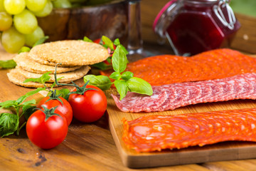 Antipasti selection on rustic wooden board