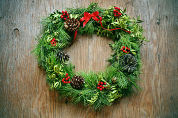 christmas wreath on a rustic door