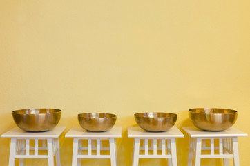 row of therapeutic Tibetan singing bowls