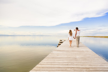 Couple walking and pointing to the horizon