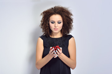 Beautiful woman holding cherry