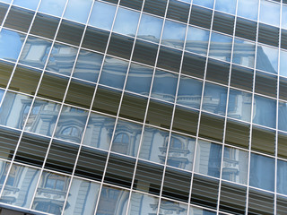 Contrast - Reflection of classical building in the windows of a