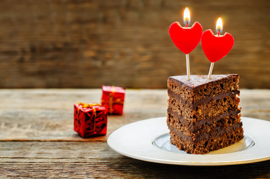 Chocolate Cake With Candles In The Shape Of A Heart