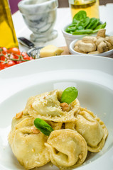 Homemade tortellini stuffed with spinach and garlic